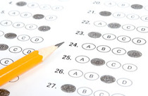 A test with bubbles marked - a pencil sitting on top